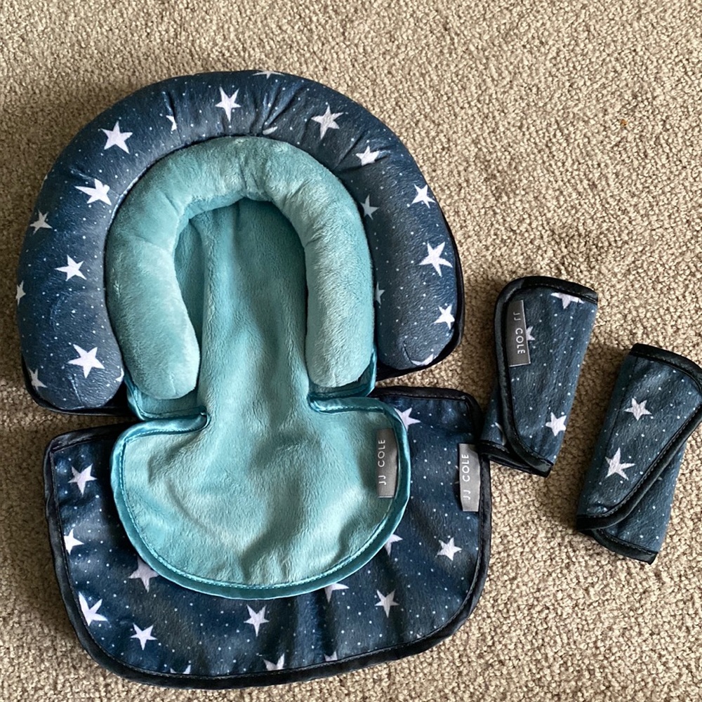 JJ Cole car seat insert with strap covers.